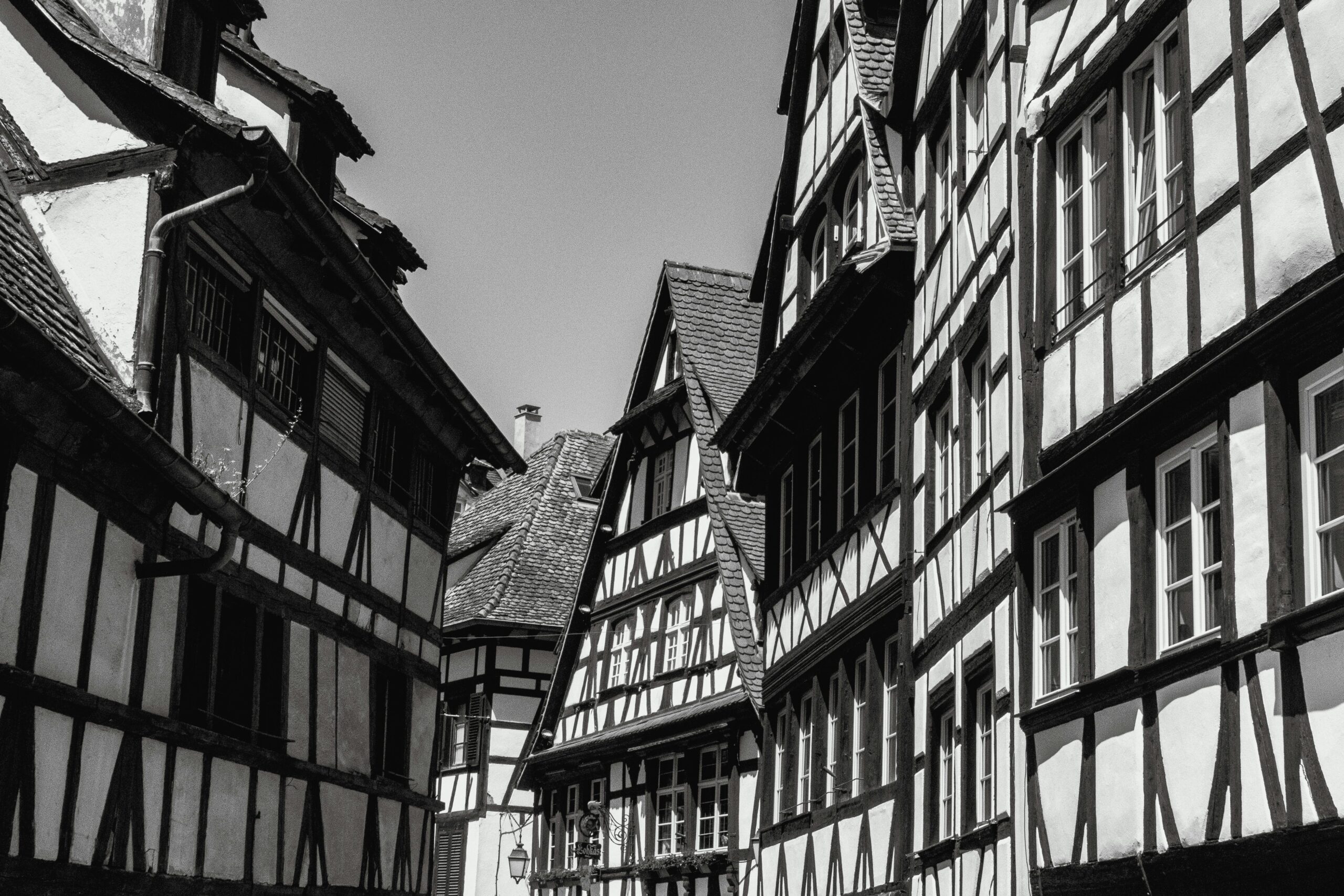 Historical half-timbered houses in Strasbourg's old town, captured in black and white for a timeless feel.